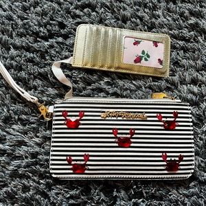 A crab design Betsey Johnson wristlet.
